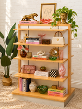 Load image into Gallery viewer, Freestanding light wood display shelf with five staggered tiers, white back panels, and open side shelving.