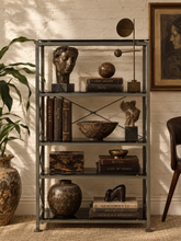 Load image into Gallery viewer, Tall industrial metal étagère with four smoked glass shelves, slim square frame, and X-brace detailing