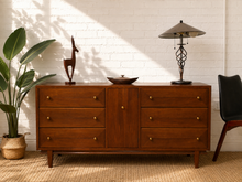 Load image into Gallery viewer, Vintage mid-century walnut nine-drawer credenza with six exterior drawers, center cabinet door, geometric fronts and brass hardware.