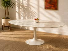 Load image into Gallery viewer, Modern oval white marble dining table with gray veining and sculptural white tulip pedestal base.