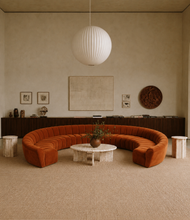 Load image into Gallery viewer, Large rust velvet curved conversation pit sectional sofa with deep channel tufting and horseshoe-shaped seating.