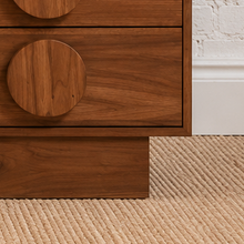 Load image into Gallery viewer, Nine-drawer Moonlight wood dresser with warm wood grain, low rectangular silhouette, and oversized round wooden drawer pulls