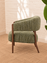 Load image into Gallery viewer, Abby accent chair upholstered in textured sage amber bouclé with curved wraparound backrest, cushioned seat and exposed brown wood legs.