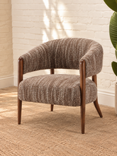 Load image into Gallery viewer, Abby mocha textured bouclé accent chair with curved wraparound backrest, cushioned seat and exposed brown solid wood legs.