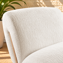 Load image into Gallery viewer, Image 5 of 5: Adele Lounge Chair in Vanilla Oat polyester fabric with sculptural curved form and natural wood frame