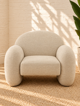 Load image into Gallery viewer, Adriana ivory chenille accent chair with rounded wraparound back, curved upholstered arms, plush seat cushion, and sculptural silhouette.