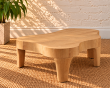 Load image into Gallery viewer, Alani solid oak coffee table in a natural oak finish with an abstract freeform tabletop, rounded edges, and tapered wood legs.