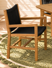 Load image into Gallery viewer, Alessia warm teak outdoor dining table with four black woven rope armchairs