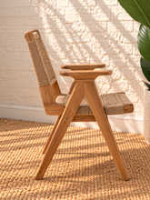 Load image into Gallery viewer, Alma natural teak wood dining armchair with tall synthetic rope woven back, woven seat, and curved wooden armrests.