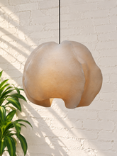 Load image into Gallery viewer, Alora hanging lamp in oyster resin with overlapping organic panels, softly undulating edges, textured surface, and dark cord suspension.