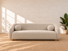 Load image into Gallery viewer, Image 1 of 6: Amara 85-inch upholstered sofa in Greige chenille with curved back, rounded arms, ball accent pillows, and wood bun feet