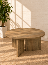 Load image into Gallery viewer, Image 1 of 5: Arni 35.5-inch round wood coffee table in Weathered Natural with sculptural three-panel base and wood-grain finish