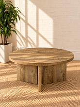 Load image into Gallery viewer, Image 5 of 5: Arni 35.5-inch round wood coffee table in Weathered Natural with sculptural three-panel base and wood-grain finish