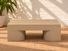 Load image into Gallery viewer, Arnold square coffee table in natural mindi wood veneer with a thick tabletop and sculptural curved supports.