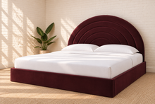 Load image into Gallery viewer, Astrid King-size bed in Burgundy performance velvet with sculptural arched headboard and streamlined plinth base.