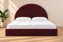Load image into Gallery viewer, Astrid King-size bed in Burgundy performance velvet with sculptural arched headboard and streamlined plinth base.