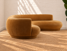 Load image into Gallery viewer, Audrey two-piece curved sectional sofa upholstered in mustard chenille with rounded arms and a sculptural wraparound back.