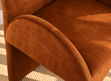 Load image into Gallery viewer, Bailey upholstered dining chair in Burnt Cognac velvet with curved arms and sculptural contemporary frame