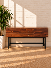 Load image into Gallery viewer, Image 1 of 4: Briar 3-drawer vanity desk in Warm Walnut with solid Acacia construction, compartmented drawer, black Iron legs, and Gold-tone pulls