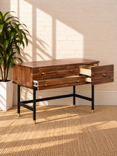 Load image into Gallery viewer, Image 3 of 4: Briar 3-drawer vanity desk in Warm Walnut with solid Acacia construction, compartmented drawer, black Iron legs, and Gold-tone pulls