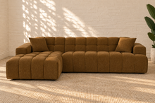 Load image into Gallery viewer, Cayden caramel upholstered L-shaped sectional sofa with left-facing chaise, tufted seat and back, square arms, and two matching throw pillows.