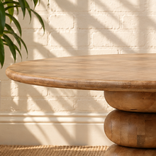 Load image into Gallery viewer, Charlie round natural mango wood dining table with broad tabletop and sculptural rounded pedestal base.