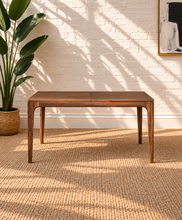 Load image into Gallery viewer, Cody extendable dining table in natural hazelnut brown acacia wood with rounded corners, curved legs and integrated butterfly extension.