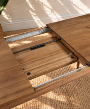 Load image into Gallery viewer, Cody extendable dining table in natural hazelnut brown acacia wood with rounded corners, curved legs and integrated butterfly extension.