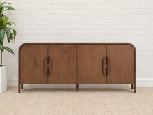 Load image into Gallery viewer, Collin four-door dark walnut media cabinet with rounded upper corners, integrated wood pulls and slim solid wood legs.