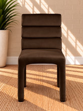 Load image into Gallery viewer, Conrad upholstered dining chair in Espresso velvet with deep channel-tufted back and sculptural upholstered frame