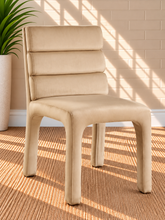 Load image into Gallery viewer, Conrad upholstered dining chair in Vanilla Sand velvet with deep channel-tufted back and sculptural upholstered frame