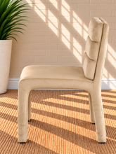 Load image into Gallery viewer, Conrad upholstered dining chair in Vanilla Sand velvet with deep channel-tufted back and sculptural upholstered frame