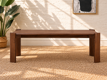 Load image into Gallery viewer, Darius rectangular dining table in natural brown Mindi wood veneer with wide panel legs and visible wood grain.