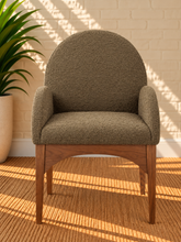 Load image into Gallery viewer, Davila Walnut dining armchair upholstered in Weathered Olive bouclé with curved arms and sculptural wood frame