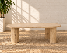 Load image into Gallery viewer, Eisley beige travertine freeform coffee table with three cylindrical pedestal legs and natural stone variation.