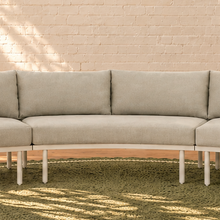 Load image into Gallery viewer, Elara curved outdoor sectional sofa in Warm Stone with plush cushions, slim aluminum legs, and woven rope detailing