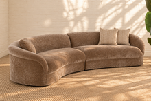 Load image into Gallery viewer, Ellie mocha beige curved two-piece sectional sofa with rounded arms, tight upholstered seat and back, and three coordinating throw pillows.