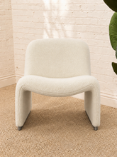 Load image into Gallery viewer, Etta white upholstered accent chair with rounded back, curved seat, sculptural side panels and silver-tone feet.