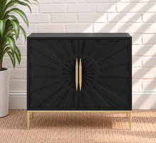 Load image into Gallery viewer, Eva midnight bar cabinet with dimensional sunburst doors, long gold handles, gold metal base, and tapered legs