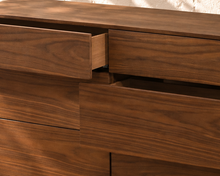 Load image into Gallery viewer, Finley six-drawer dresser in warm walnut with natural wood grain, rounded corner frame and handle-free push-to-open drawer fronts.