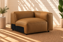 Load image into Gallery viewer, Florence three-piece modular sectional sofa in caramel vegan leather with deep seats, low backrests, and wide upholstered arms