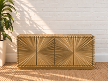 Load image into Gallery viewer, Gloria 4-Door Buffet Credenza in Radiant Gold with intricate hand-carved starburst doors and sculptural ridged detailing