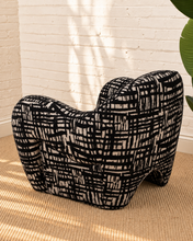 Load image into Gallery viewer, Hadley black and beige patterned upholstered accent chair with rounded arms, curved back and sculptural arched base.