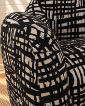 Load image into Gallery viewer, Hadley black and beige patterned upholstered accent chair with rounded arms, curved back and sculptural arched base.
