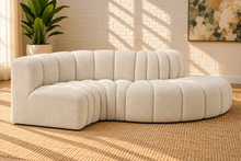 Load image into Gallery viewer, Hampton 4-piece sectional sofa in Creamy White boucle with deep channel tufting, rounded edges, curved seating, and contemporary modular design.