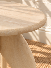 Load image into Gallery viewer, Jillian side table in sand-finished mango wood with an elongated oval tabletop, rounded edges, and sculptural tapered pedestal base.