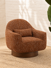 Load image into Gallery viewer, Katiana rust chunky bouclé swivel accent chair with rounded back, curved arms, cushioned seat, and dark rubber wood base.