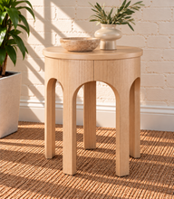 Load image into Gallery viewer, Kaylee sculptural side table in blonde oak with rounded top and arched openwork base.