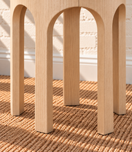 Load image into Gallery viewer, Kaylee sculptural side table in blonde oak with rounded top and arched openwork base.