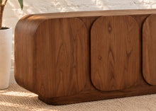 Load image into Gallery viewer, Keanu natural brown mindi wood credenza with four rounded cabinet doors, curved corners, low plinth base, and interior shelving.